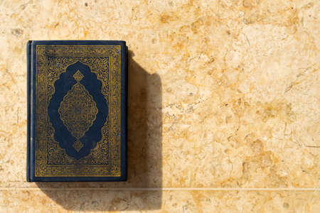 Muslim Holy Book Quran on Ceramic Backgroundの写真素材