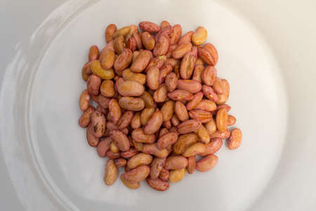 Straight Taken Stack of Cashews on White Plateの写真素材