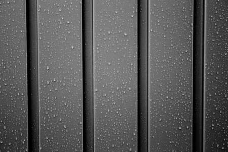 Gray metal profile with rain dropsの写真素材