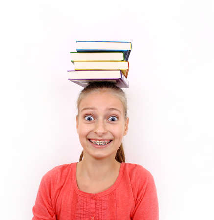 Funny girl with four books on head