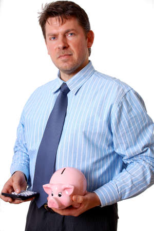 Businessman with calculator and pink piggy bank isolatedの写真素材