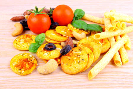 Mediterrean snack, pizza crackers, dried olives, nuts, tomatoes, close upの写真素材