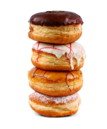 Four delicious, assorted german donuts as tower, isolatedの写真素材