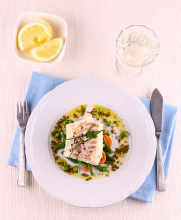 Cod Fillet with green beans, peas, parsley, olive oil and wine, top viewの写真素材