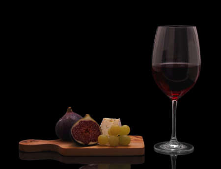 Red wine with cheese, figs and grapes isolated on black の写真素材