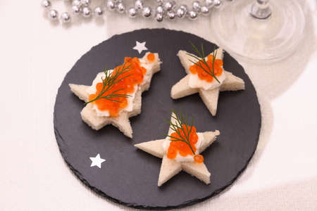 Star bread with red caviar, Champagne, card, top viewの写真素材