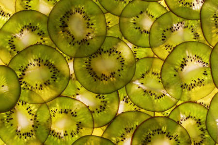 Kiwi fruit sliced as a background, top viewの写真素材