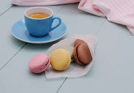 Tracing paper cornet with macarons and Blue Espresso Cup, retro colorの写真素材