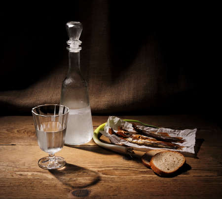 Still Life, glass of vodka with dried capelin and breadの写真素材