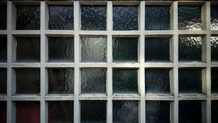 Dirty wall from square wooden frame and glass as backgroundの写真素材