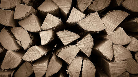 Neatly stacked wood as background, close up