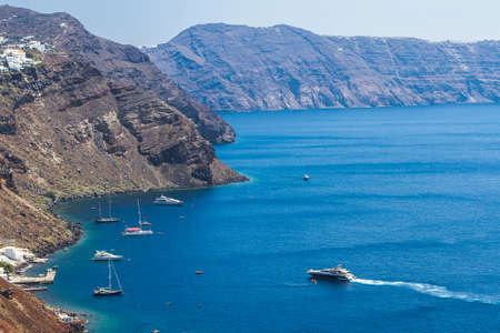 Santorini bay with many yacht in Greece, top viewの写真素材