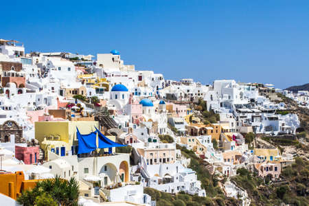 Sky, sea near traditional white village in Santoriniの写真素材