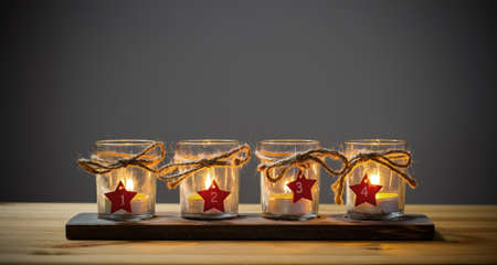 Four Advent candles on grey, fourth Adventの写真素材
