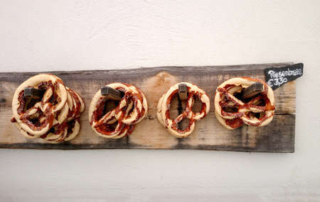 Giant pretzel on board for sale, soft focusの写真素材