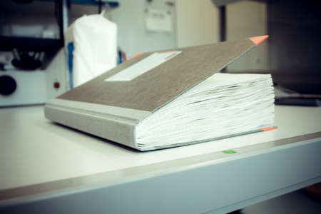 Thick laboratory journal at work, soft focusの写真素材