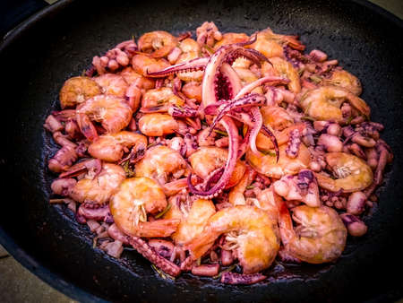 Fried seafood in the pan, top viewの写真素材