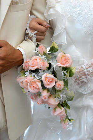 Watch the young two people of prospects, bouquet in shades of rose, very beautiful and colorful, the bride and very a matching flower arrangementの写真素材
