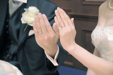 Unveiling of the wedding ring by the bride and groom, you both happiness is very dazzling sceneの写真素材