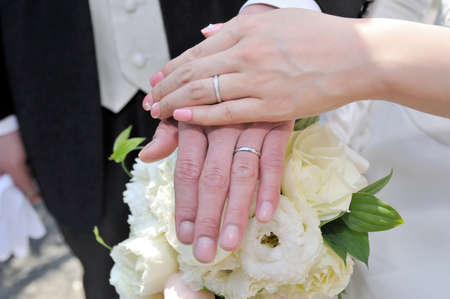 Show off in front of the wedding ring with bride and groomの写真素材