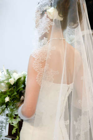 Wedding bride facing the wedding dress, the train is niceの写真素材
