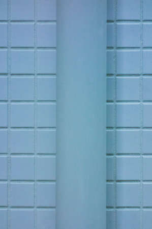 A light blue tube crawling on the wallの写真素材