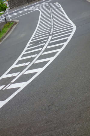 Roads interwoven with distorted curves with little traffic in the suburbsの写真素材