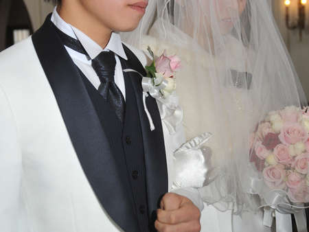 Bridal image, chapel wedding of bride and groom, brilliant and graceful ceremony to realize eternal happiness of two peopleの写真素材
