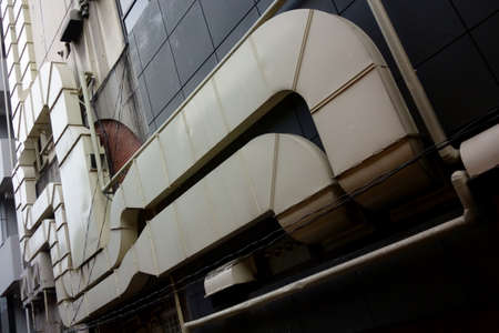 Ventilation tube crawls outside the modern building