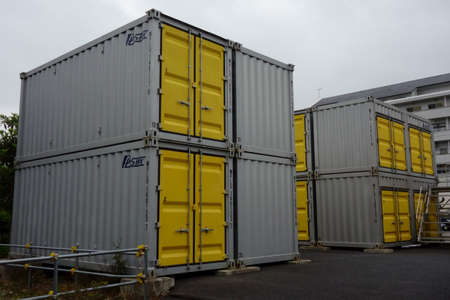 Cargo container depot for rent, in the background on an urban vacant lotの写真素材