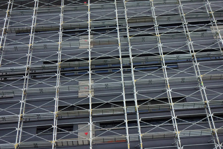 Scaffolding work on modern building construction site