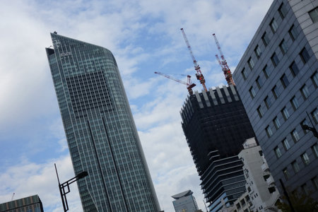 Modern stylish building exterior view in overcrowded city Tokyo Japanの写真素材