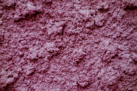Pink color color abstract background, uneven plaster wall textureの写真素材