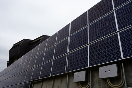 Photovoltaic power generation system equipment panel plate wall attached to a residential buildingの写真素材
