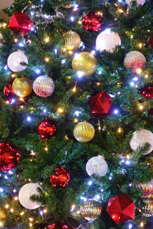 Christmas tree decoration object, joyful and joyful season, graceful and splendid Christmas tree of lights and ballsの写真素材