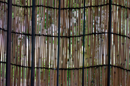 Blindfold that doubles as a fence in an Asian-style archaic style woven from kayaの写真素材