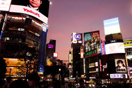 Shibuya, Tokyo Japan - June 24, 2023: Near the scramble crossing in front of Shibuya station crowded with people at twilightのeditorial素材