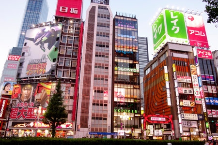 Shinjuku, Tokyo, Japan - August 03, 2023: People walking in the world-famous Shinjuku East Exit, Kabukicho, neon illuminations and the bustling entertainment district of Tokyo.のeditorial素材