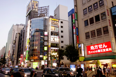 Shinjuku, Tokyo, Japan - August 03, 2023: People walking in the world-famous Shinjuku East Exit, Kabukicho, neon illuminations and the bustling entertainment district of Tokyo.のeditorial素材