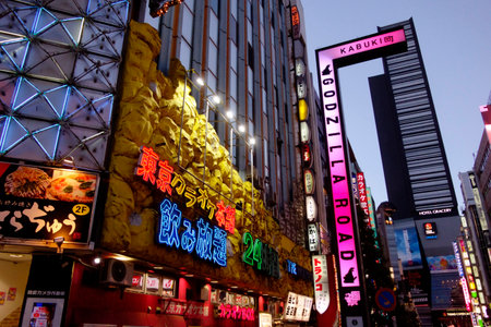 Shinjuku, Tokyo, Japan - August 03, 2023: People walking in the world-famous Shinjuku East Exit, Kabukicho, neon illuminations and the bustling entertainment district of Tokyo.のeditorial素材