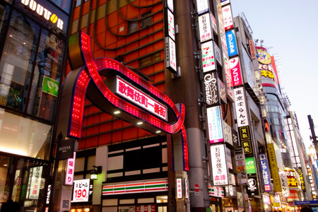 Shinjuku, Tokyo, Japan - August 03, 2023: People walking in the world-famous Shinjuku East Exit, Kabukicho, neon illuminations and the bustling entertainment district of Tokyo.のeditorial素材