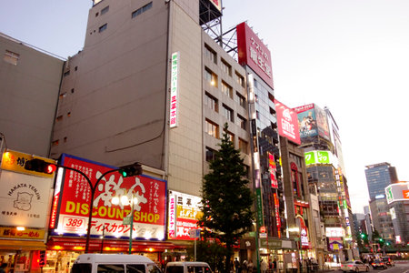 Shinjuku, Tokyo, Japan - August 03, 2023: People walking in the world-famous Shinjuku East Exit, Kabukicho, neon illuminations and the bustling entertainment district of Tokyo.のeditorial素材