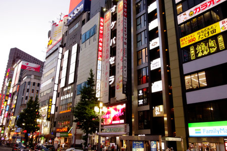 Shinjuku, Tokyo, Japan - August 03, 2023: People walking in the world-famous Shinjuku East Exit, Kabukicho, neon illuminations and the bustling entertainment district of Tokyo.のeditorial素材