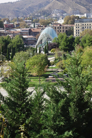 November 6, 2023, Tbilisi, Georgia, trendy symbol landmark, beautiful deformed green Peace Bridgeのeditorial素材