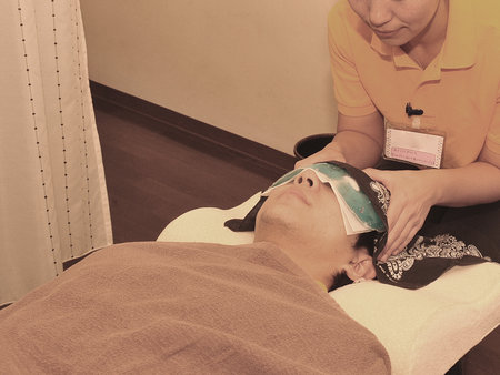 Relaxation treatment, pressure points on the soles of the feet and head spaの写真素材