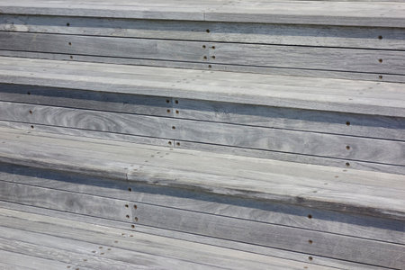 Stairs with wooden plank flooring made of aged wooden boardsの写真素材