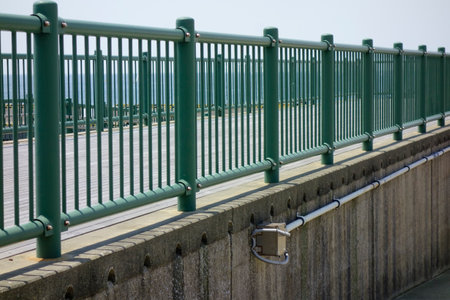 An iron fence installed on the breakwater at Hayama Marina Portの写真素材