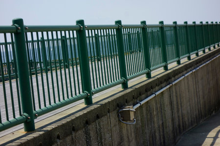 An iron fence installed on the breakwater at Hayama Marina Portの写真素材