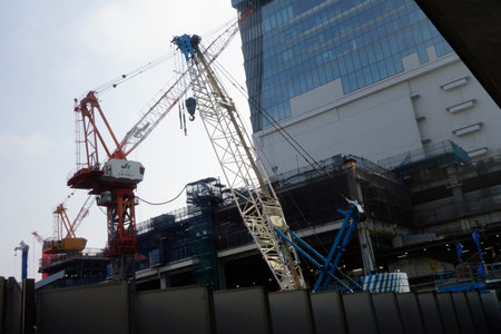 Shibuya, Tokyo, Japan, July 8, 2025: Various large cranes are in operation as part of a once-in-a-century redevelopment project around the station.のeditorial素材