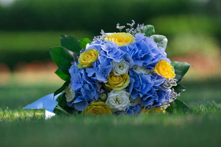 wedding bouquet on the grassの写真素材